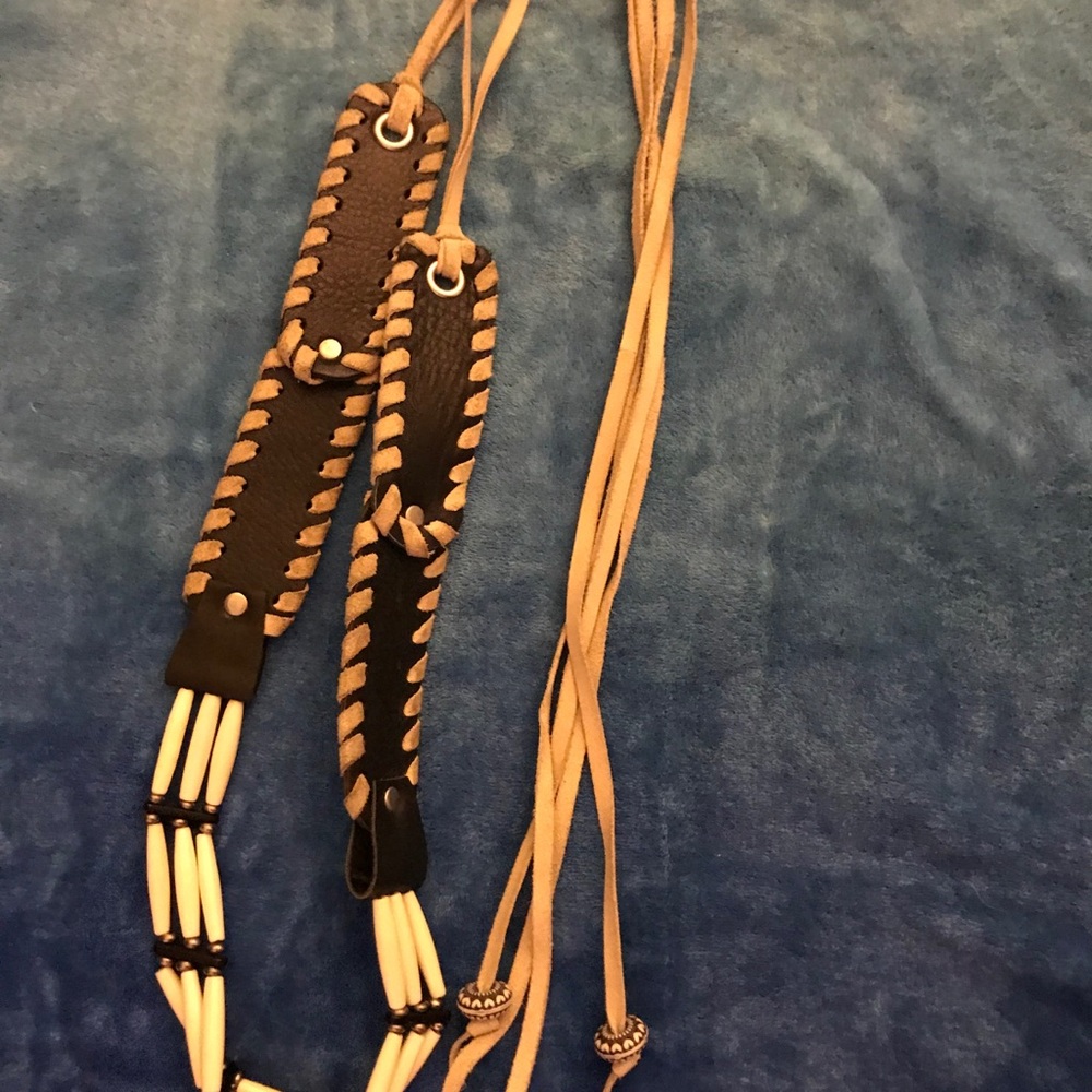 Used black Bebe black leather belt. Size large.